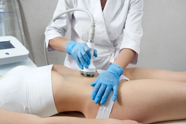 Lost the Weight but Not the Loose Skin? 2 woman having HIFU treatment on her stomach to combat loose skin Clacton-on-Sea following weight loss